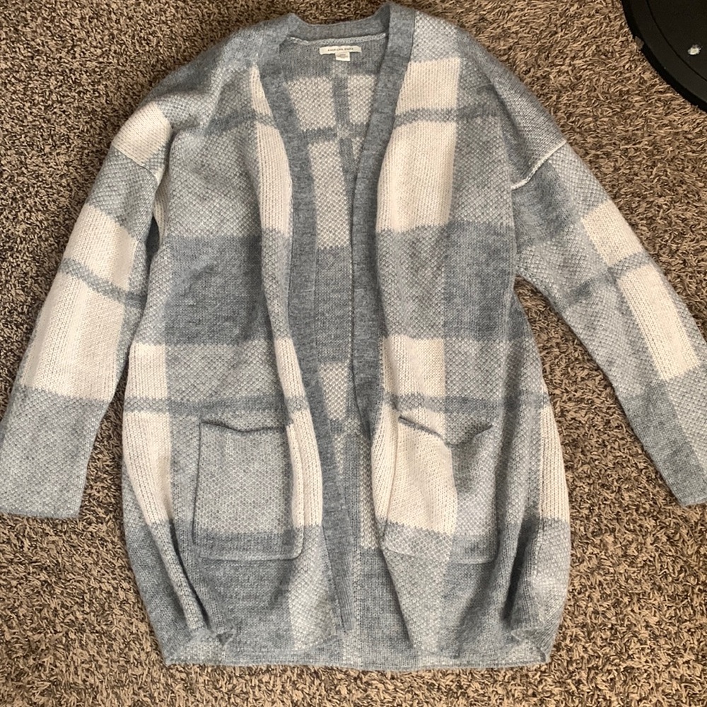 a grey/white cardigan from american eagle.